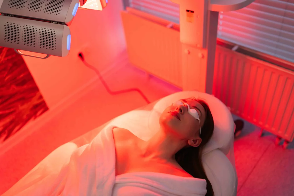 Woman receiving LED light therapy facial at Invein Aesthetics in Baltimore, MD